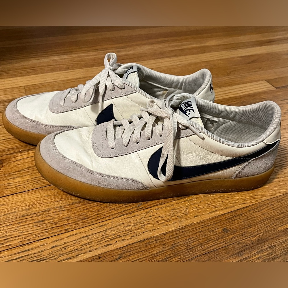 Nike Men’s Size 12 shoes. White shoes with navy blue swoosh. Good condition.